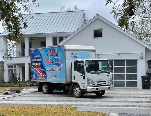 Central Heating And Air Truck In Front Of House